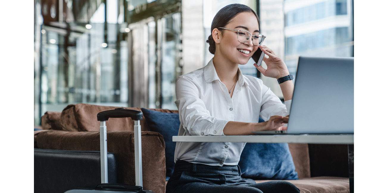 Businesswoman working as she waits for her flight
