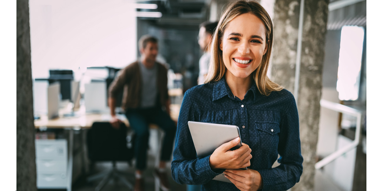 Happy HR professional smiling in a modern office